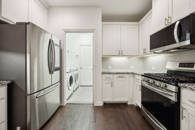 2321 Molly Ln, Plano, TX 75074 - kitchen featuring light stone countertops, white cabinetry, washer and dryer, stainless steel appliances, and dark wood-style floors