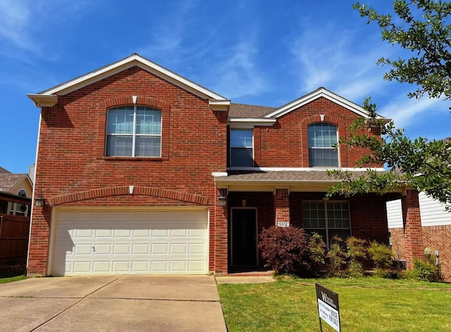 traditional-style home with brick siding, a front lawn, driveway, and an attached garage