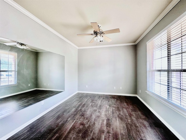 empty room featuring crown molding, a ceiling fan, baseboards, and dark wood finished floors