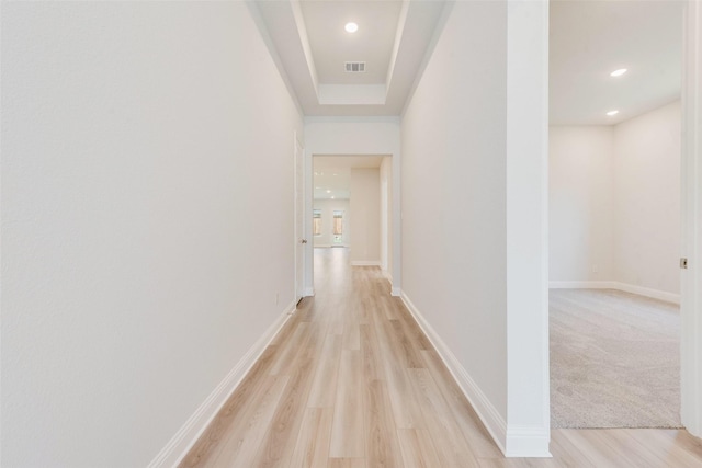 corridor with recessed lighting, visible vents, light wood-style flooring, and baseboards