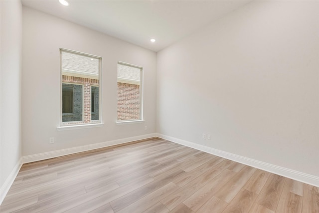 unfurnished room featuring baseboards, recessed lighting, and light wood-style floors