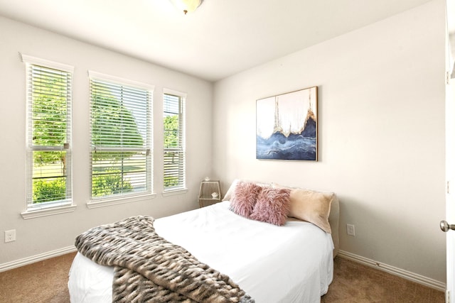 bedroom featuring carpet flooring and baseboards