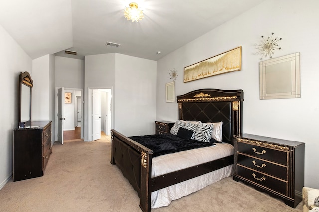 bedroom featuring visible vents, light carpet, and baseboards