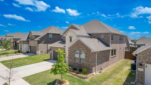 4114 Anglers Way, Royse City, TX 75189 - view of front of property with a shingled roof, a residential view, central AC, brick siding, and concrete driveway