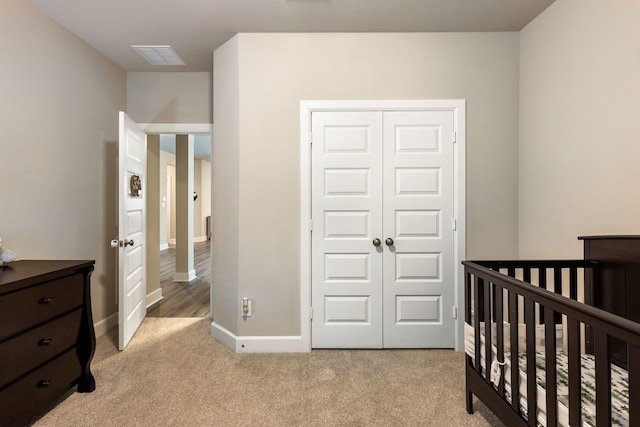 4114 Anglers Way, Royse City, TX 75189 - bedroom featuring a closet, visible vents, a nursery area, baseboards, and light colored carpet