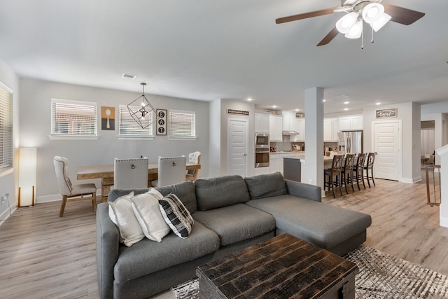4114 Anglers Way, Royse City, TX 75189 - living area with light wood-style flooring, visible vents, baseboards, recessed lighting, and a ceiling fan