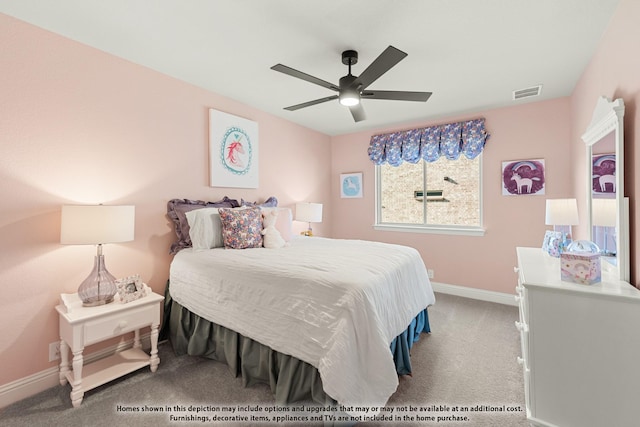 carpeted bedroom with baseboards, visible vents, and ceiling fan