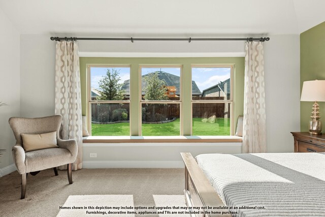 carpeted bedroom featuring baseboards