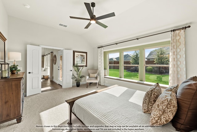 bedroom with vaulted ceiling, baseboards, visible vents, carpet, and a ceiling fan