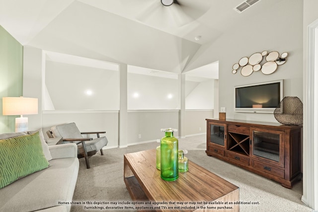 carpeted living area with lofted ceiling, a ceiling fan, and visible vents