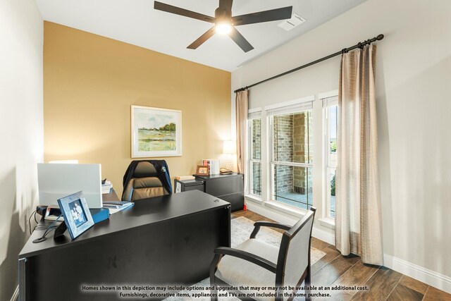 office featuring baseboards, visible vents, dark wood-type flooring, and ceiling fan