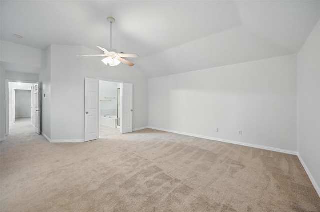 1405 Blue Gill Ln, Crowley, TX 76036 - interior space featuring a ceiling fan, vaulted ceiling, baseboards, connected bathroom, and light carpet