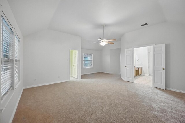 1405 Blue Gill Ln, Crowley, TX 76036 - interior space with visible vents, vaulted ceiling, baseboards, light carpet, and ensuite bath