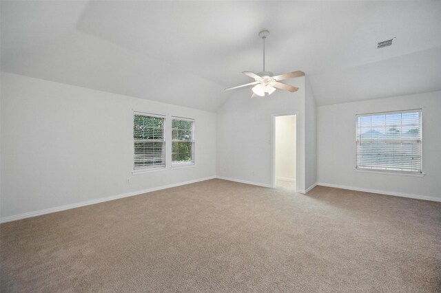 1405 Blue Gill Ln, Crowley, TX 76036 - carpeted spare room with plenty of natural light, ceiling fan, vaulted ceiling, and visible vents