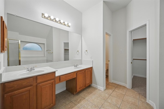 1405 Blue Gill Ln, Crowley, TX 76036 - full bath with double vanity, a sink, and a walk in closet
