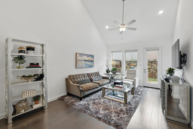 living area featuring recessed lighting, ceiling fan, high vaulted ceiling, baseboards, and wood finished floors