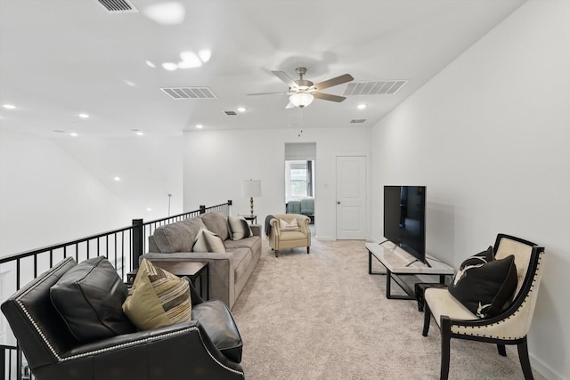 living area with recessed lighting, a ceiling fan, visible vents, and light carpet