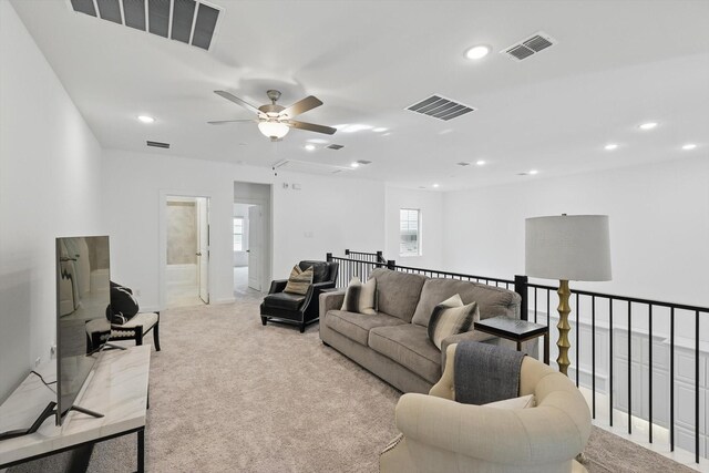 living room featuring recessed lighting and visible vents