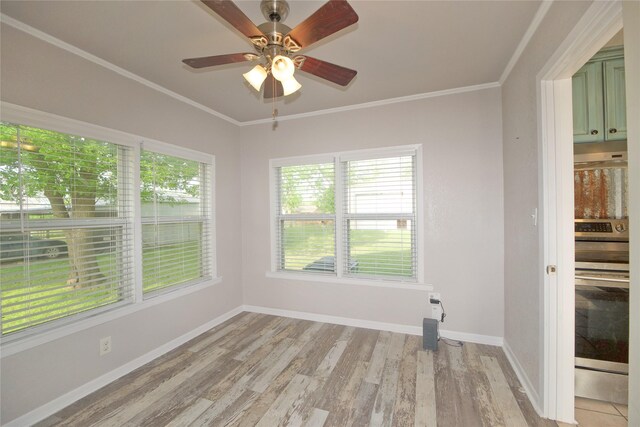 216 S Mesquite St, Muenster, TX 76252 - unfurnished room with light wood-style floors, baseboards, and ornamental molding