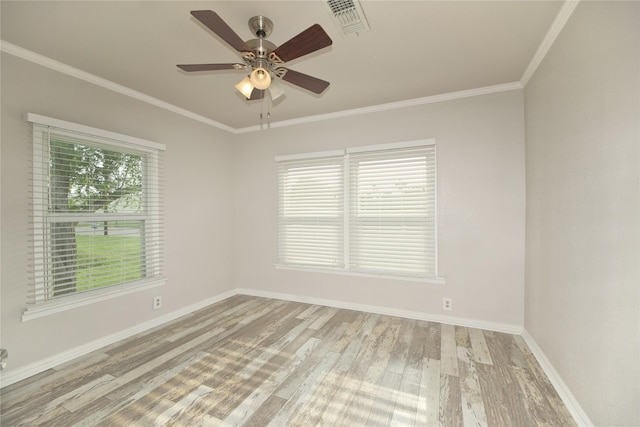216 S Mesquite St, Muenster, TX 76252 - unfurnished room with crown molding, baseboards, visible vents, and wood finished floors