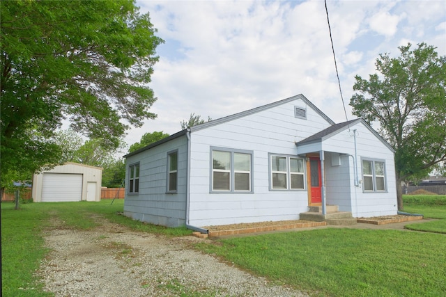 216 S Mesquite St, Muenster, TX 76252 - bungalow-style house featuring driveway, a detached garage, fence, an outdoor structure, and a front lawn
