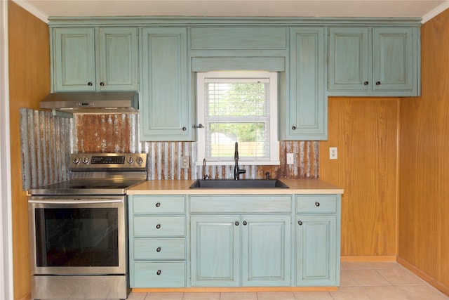 216 S Mesquite St, Muenster, TX 76252 - kitchen featuring stainless steel electric range, a sink, light countertops, green cabinets, and under cabinet range hood