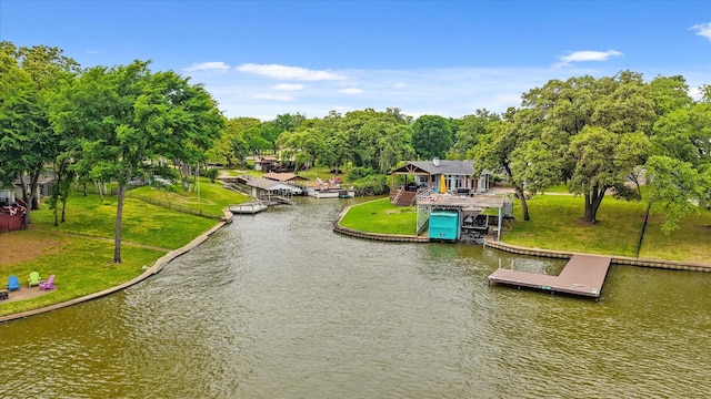 exterior space with a boat dock and a water view