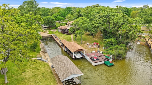 view of dock with boat lift and a water view