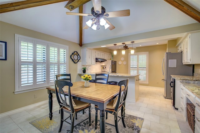 dining space with recessed lighting, light tile patterned floors, ceiling fan, vaulted ceiling, and baseboards