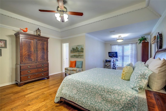bedroom with baseboards, visible vents, ceiling fan, and light wood finished floors