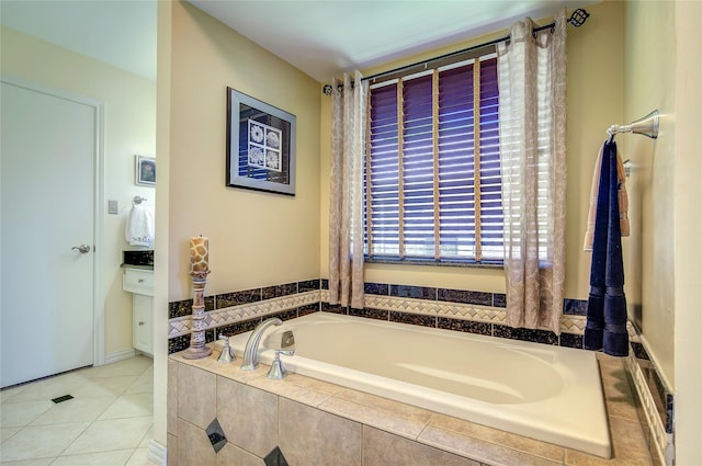 full bathroom with a garden tub and tile patterned floors