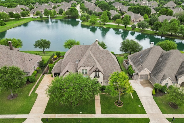 aerial view with a residential view and a water view