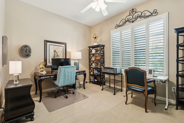 office area with ceiling fan, carpet flooring, and baseboards