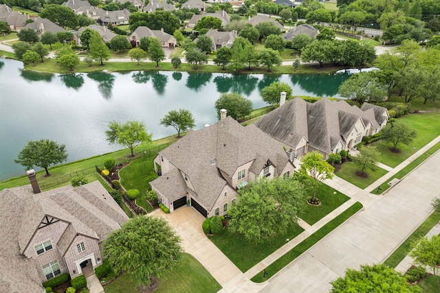 aerial view with a residential view and a water view