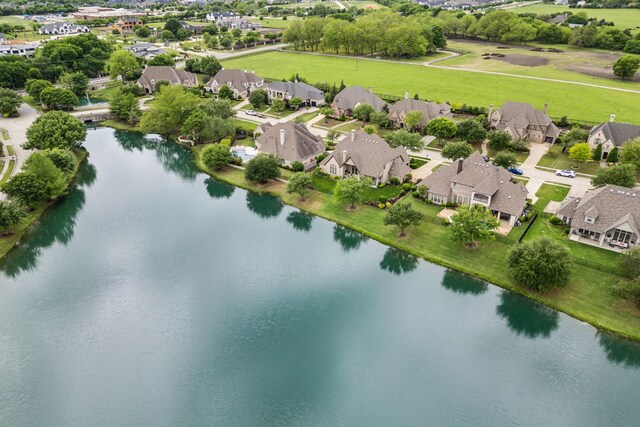birds eye view of property featuring a residential view and a water view