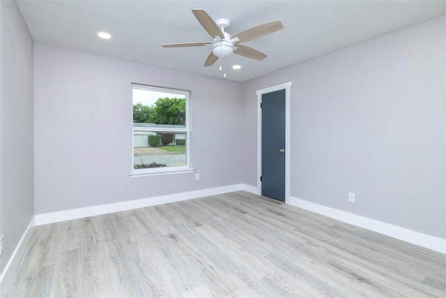 empty room with recessed lighting, baseboards, a ceiling fan, and wood finished floors