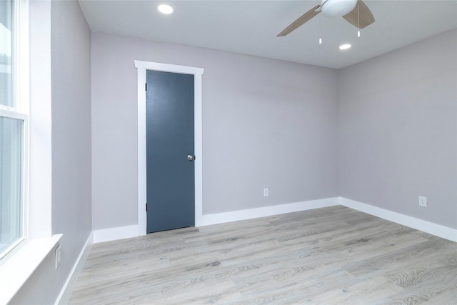 spare room with recessed lighting, baseboards, a ceiling fan, and wood finished floors