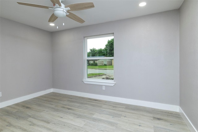 spare room featuring recessed lighting, baseboards, a ceiling fan, and wood finished floors