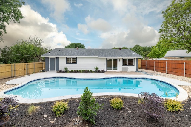view of pool featuring a patio area, a fenced backyard, and a fenced in pool