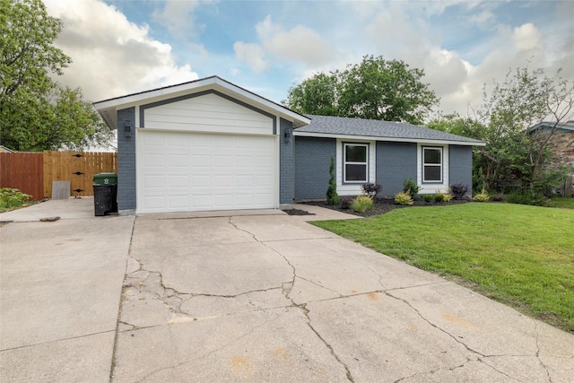 ranch-style house with concrete driveway, a front yard, brick siding, and a garage