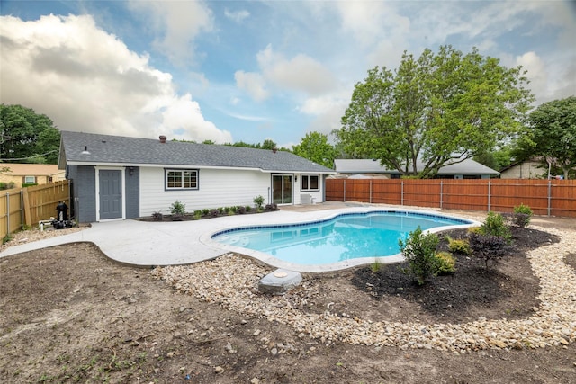 view of pool featuring a fenced backyard, a patio area, and a fenced in pool