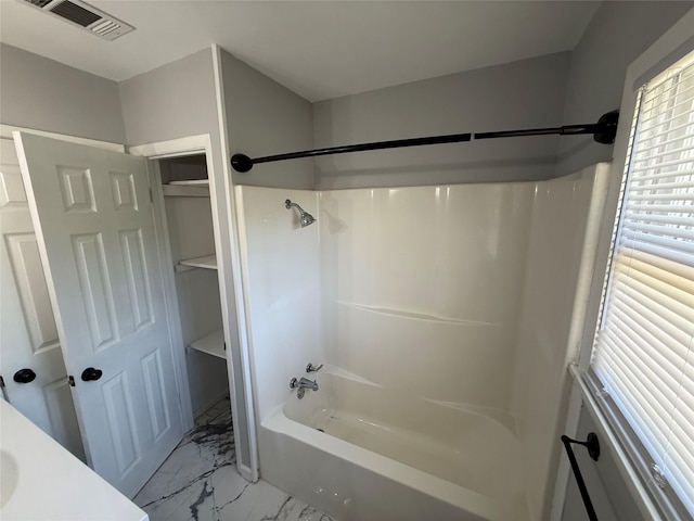 full bath featuring marble finish floor, visible vents, and  shower combination