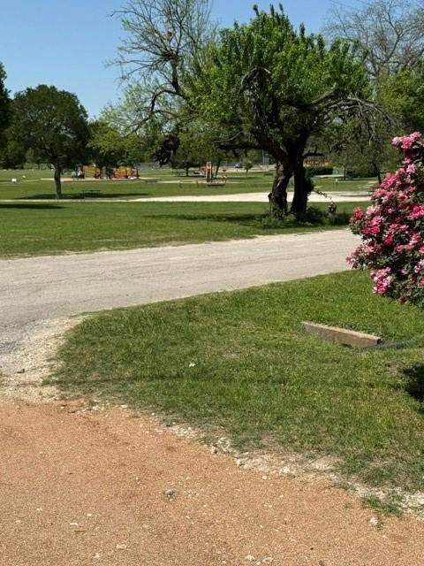 surrounding community with a lawn