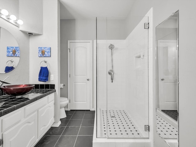 2024 Crestside Dr, Carrollton, TX 75007 - bathroom featuring a shower stall, tile patterned flooring, toilet, and vanity