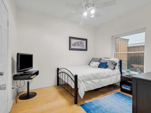 2024 Crestside Dr, Carrollton, TX 75007 - bedroom featuring wood finished floors, baseboards, and ceiling fan