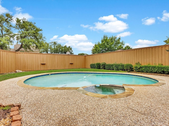 2024 Crestside Dr, Carrollton, TX 75007 - view of swimming pool with a fenced backyard and a pool with connected hot tub
