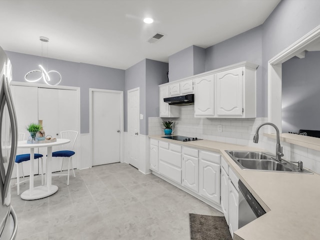 2024 Crestside Dr, Carrollton, TX 75007 - kitchen with a sink, under cabinet range hood, appliances with stainless steel finishes, white cabinets, and backsplash