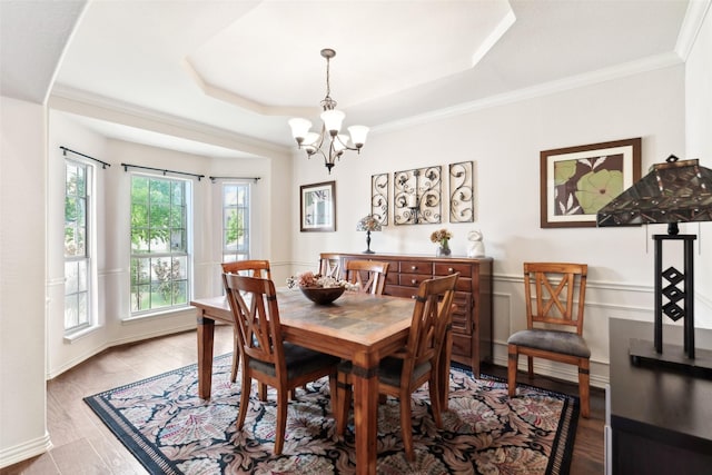 14209 Signal Hill Dr, Little Elm, TX 75068 - dining space with a tray ceiling, an inviting chandelier, and wood finished floors