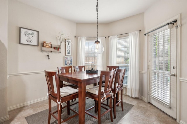 14209 Signal Hill Dr, Little Elm, TX 75068 - dining room with baseboards, light tile patterned flooring, and a wealth of natural light