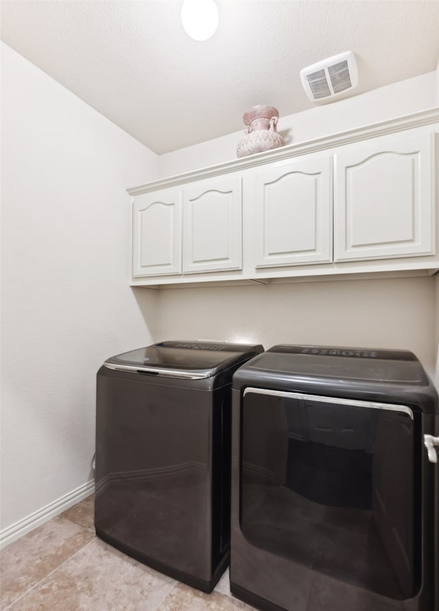 14209 Signal Hill Dr, Little Elm, TX 75068 - laundry area with baseboards, washing machine and dryer, cabinet space, and visible vents